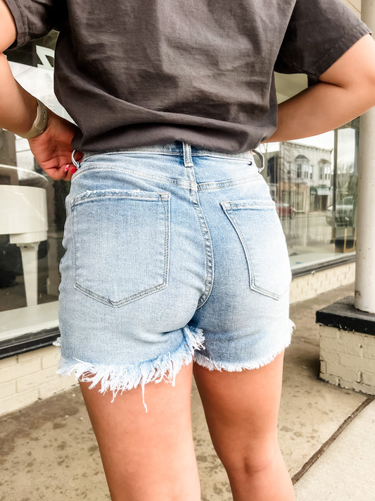 Loving God | Katie Asymmetrical Distressed Denim Shorts